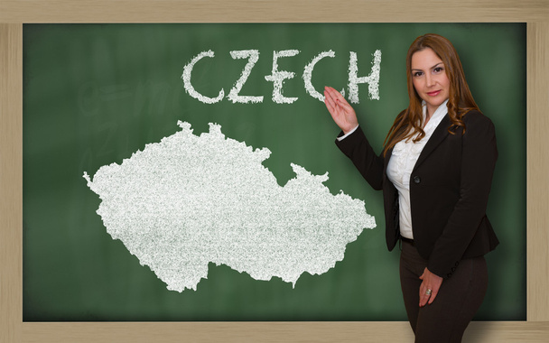 Учитель показывает карту Чехии на доске
 - Фото, изображение