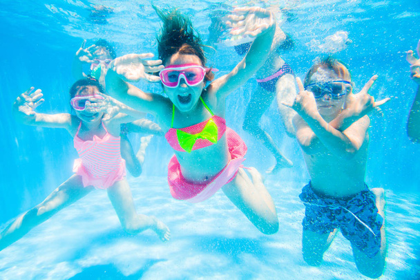 Children swim in  pool - Foto, Bild