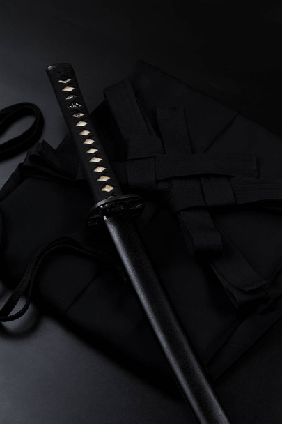 Japanese katana samurai sword. Aikido hakama, martial arts uniform - Foto, Imagem