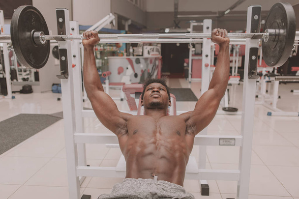African sportsman exercising at the gym - Fotó, kép