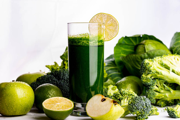 Green smoothie with apple and cauliflower on white wooden background. Raw food and drink. - Foto, Bild