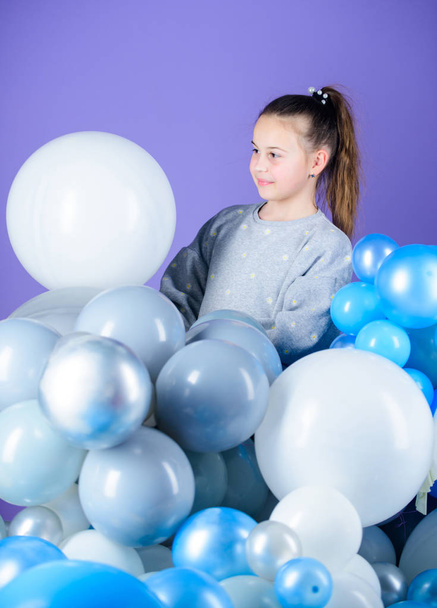 Obsessed with air balloons. Happiness positive emotions. Having fun. Balloons theme party. Girl play with air balloons. Birthday party. Childrens day. Carefree childhood. All those balloons for me - Foto, Bild