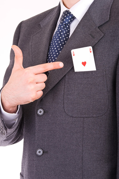 Empresario indicando tarjeta de as en su bolsillo
. - Foto, Imagen