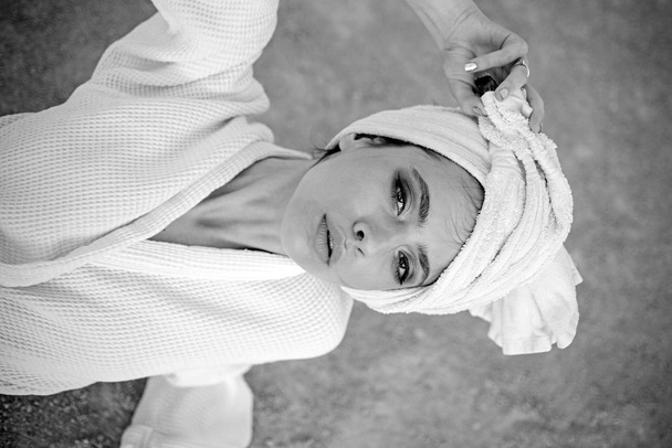 Taking care of herself. Skincare at spa. Pretty woman wear bath towel on head. Young woman in bathing gown. Skincare model after spa bath. Beauty salon. Beauty routine and hygiene care. Bathing habit - Photo, Image