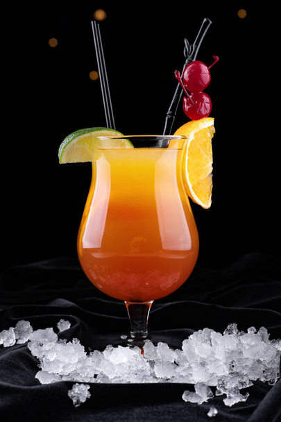 Tequila Sunrise cocktail, on a black background - Photo, Image