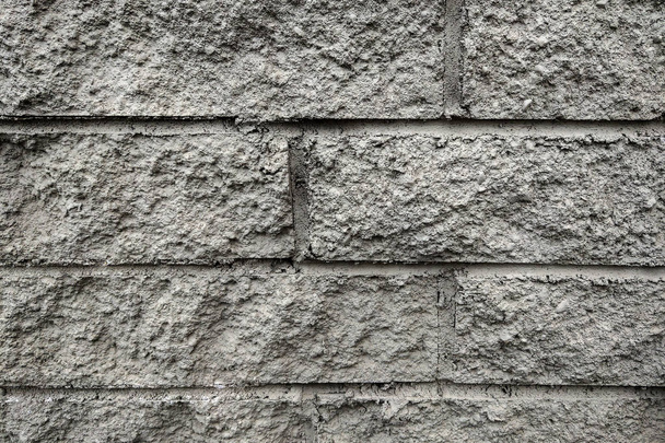 Gri duvar yüzeyi çok tuğla kullanır. Ya da eski siyah tuğla duvar soyut desen. - Fotoğraf, Görsel