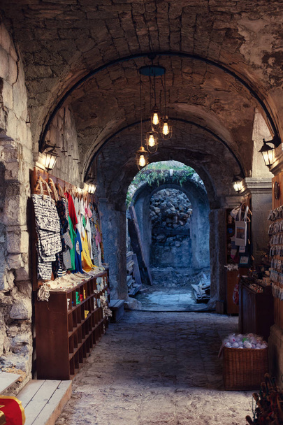 Souvenirs selection from old town Kotor, Montenegro. Souvenir trade - Фото, изображение