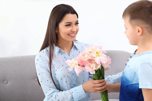 Little son congratulating his mom at home. Happy Mother's Day - Foto, imagen