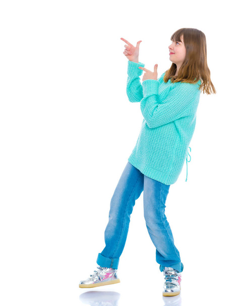 Girl teenager holds a thumb up - Фото, изображение