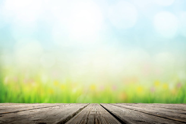 Background with sunny meadow over wooden deck - Photo, Image