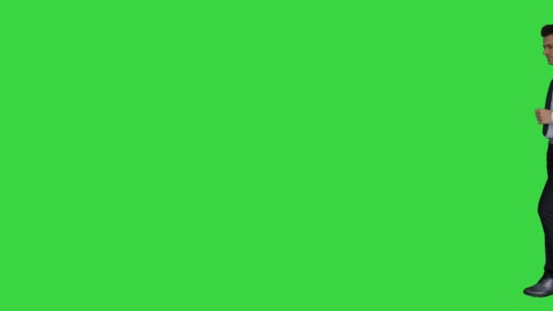 Formal man walks in frame and gets an idea then walks out on a Green Screen, Chroma Key. - Footage, Video