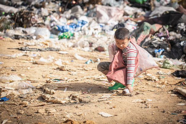 child walk to find junk for sale and recycle them in landfills,  - Photo, Image