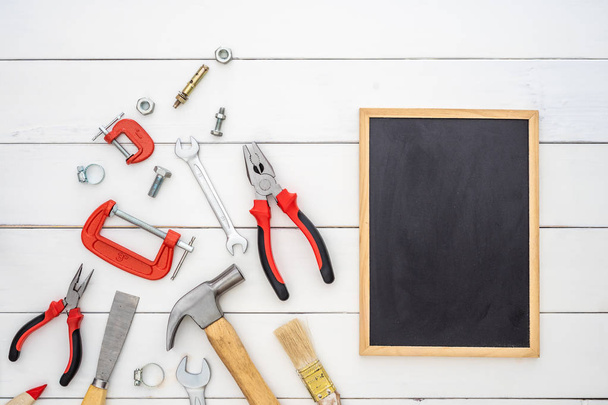 Flat lay of blank space blackboard with construction handy tools - Photo, Image
