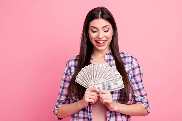 Portrait of her she nice attractive cute charming lovely cheerful cheery straight-haired lady holding in hands cash shopaholic big sale isolated over pink pastel background - Photo, Image