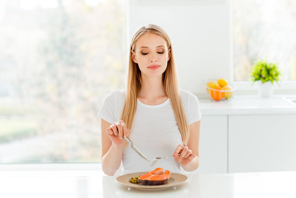 Portrait of cute charming lady dieting have lunch peas protein vegetable use snacking fork knife break pause sit big kitchen wear modern cotton clothing  - 写真・画像