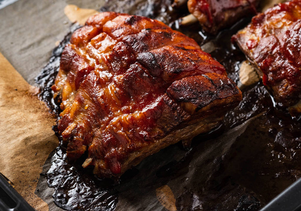Grilled pork ribs on baking paper, top view. Copy space. - Foto, Imagen