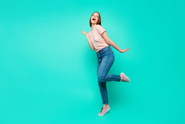Full length side profile body size photo beautiful funky her she lady pretty appearance make strange moves motion wear casual jeans denim pastel t-shirt clothes isolated teal turquoise background - Foto, Imagem