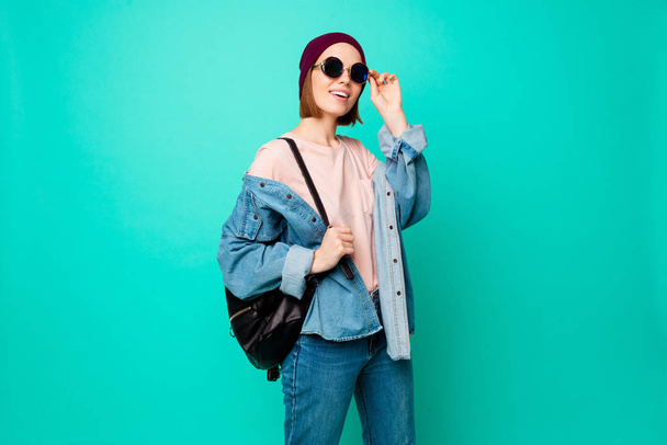 Close up photo beautiful funny her she lady modern fashionable look ready walk park meet friends fellows wear specs hat casual jeans denim pastel t-shirt clothes isolated teal turquoise background - Photo, image