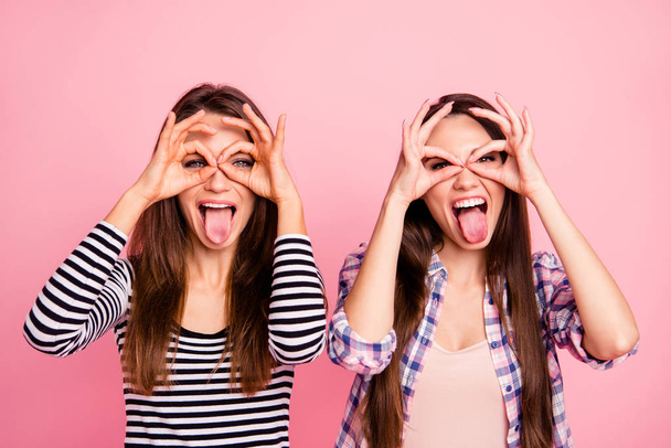 Close-up portrait of nice attractive lovely cute charming girlish crazy cheerful cheery naughty straight-haired girls showing like glasses having fun isolated over pink pastel background - 写真・画像