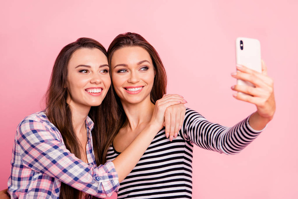 Close-up portrait of nice-looking attractive lovely sweet fascinating winsome cute charming cheerful straight-haired girls taking making selfie having fun isolated over pink pastel background - Фото, зображення
