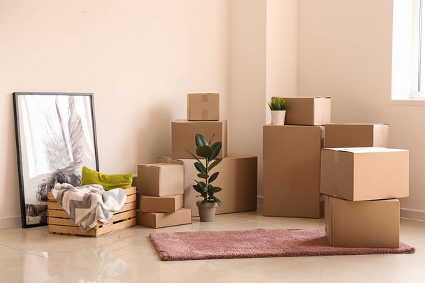 Moving boxes with belongings in empty room - Photo, Image