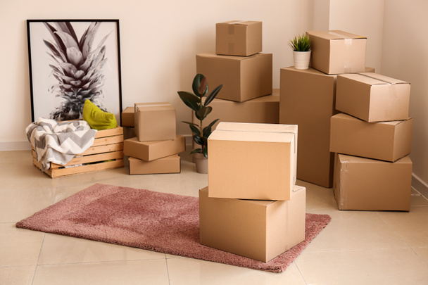 Moving boxes with belongings in empty room - Photo, Image