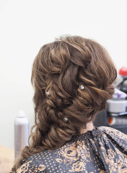 French braid with jewelry. Hairstyle with jewelry. - Photo, Image