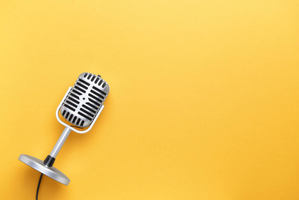 Retro microphone on color background - Photo, image