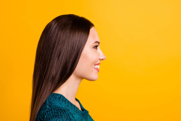 Close up side profile photo amazing beautiful her she lady long straight perfect ideal hair look empty space attractive appearance wear green knitted pullover jumper isolated yellow background - Foto, immagini