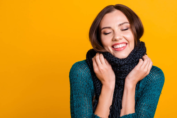 Close up photo beautiful amazing her she lady soft warm scarf around neck overjoyed white teeth eyes closed sweet kindhearted wear green knitted pullover jumper isolated yellow background - Φωτογραφία, εικόνα