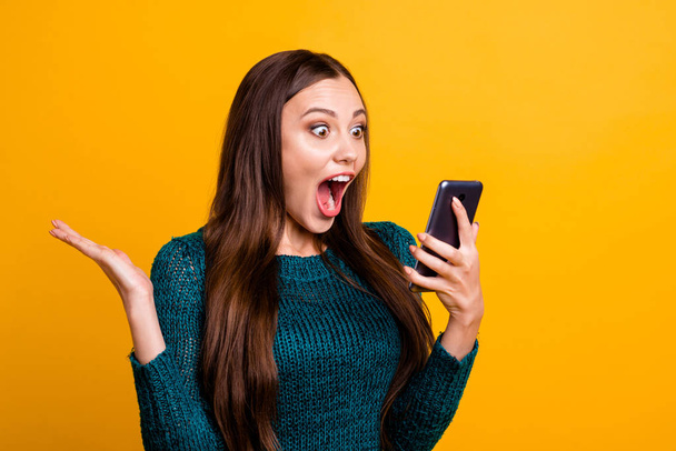 Close up photo beautiful amazing her she lady hold arms hands telephone make take selfies observe check all pictures yell cool quality wear green knitted pullover jumper isolated yellow background - Photo, Image