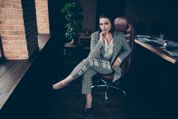 Full length body size photo amazing strict she her business lady posing camera portrait hand arm chin sit big cozy comfort chair near window sill office wear formal-wear checkered plaid suit - Photo, Image
