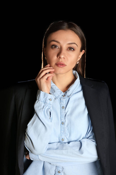 Stylish businesswoman on dark background - Photo, Image