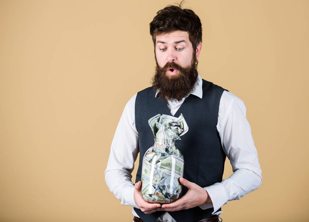 Saving money for future. Businessman focusing on current and future savings. Bearded man thinking of investing money for future profits. Borrowing money against future income, copy space - Photo, Image