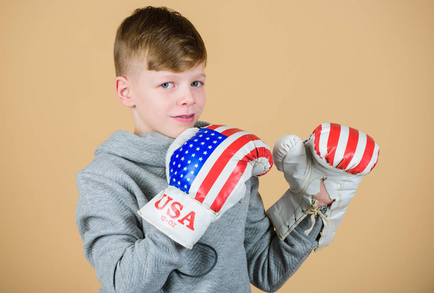 Pushing to the limit. workout of small boy boxer. usa independence day. Happy child sportsman in boxing gloves. Fitness diet. energy health. punching knockout Sport success. sportswear fashion - Valokuva, kuva