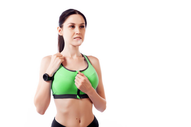 Fitness woman  ready for sports exercises wearing a smartwatch activity tracker. Fit girl living an active lifestyle - Foto, Imagem