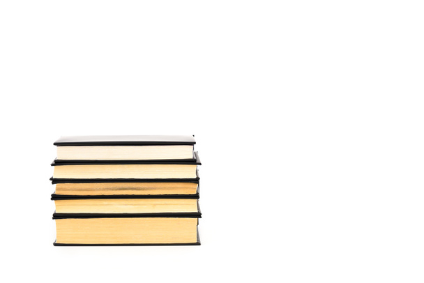 Old black hardcover books with yellow pages isolated on white - 写真・画像