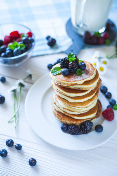 Delicious homemade pancakes with berries and milk - Photo, image