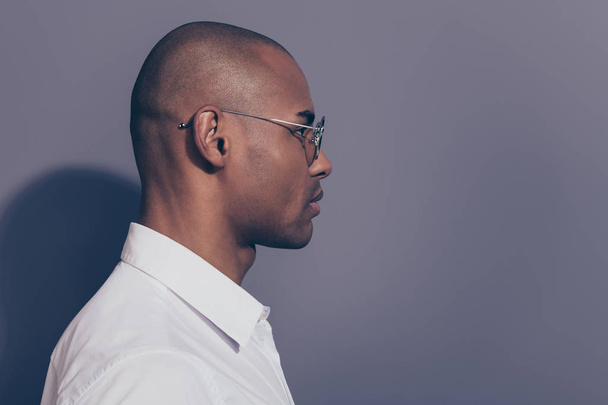 Close up side profile photo amazing dark skin he him his macho look attentively empty space listening news novelty corporate meeting shaved face wear specs white shirt isolated grey background - Фото, зображення