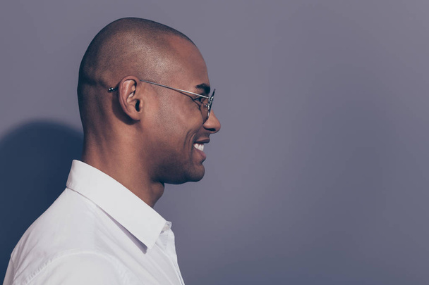 Close up side profile photo amazing dark skin he him his macho friendly attentively look empty space listen news novelty corporate meeting shaved face wear specs white shirt isolated grey background - Photo, image