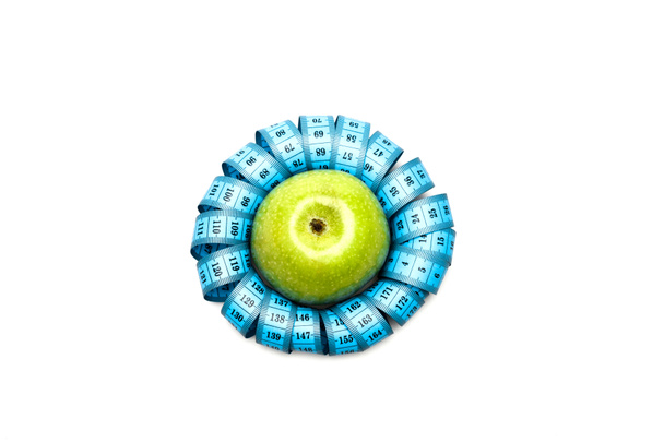 Top näkymä vihreä omena ja sininen mittanauha eristetty valkoinen
 - Valokuva, kuva