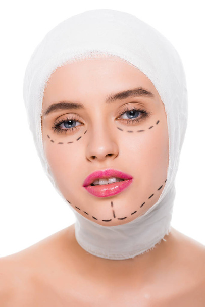 woman with bandaged head and marks on face isolated on white  - Фото, зображення