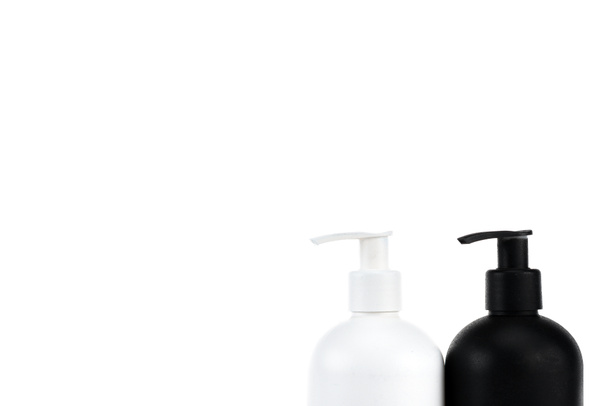 Black and white cosmetic spray bottles isolated on white - Φωτογραφία, εικόνα