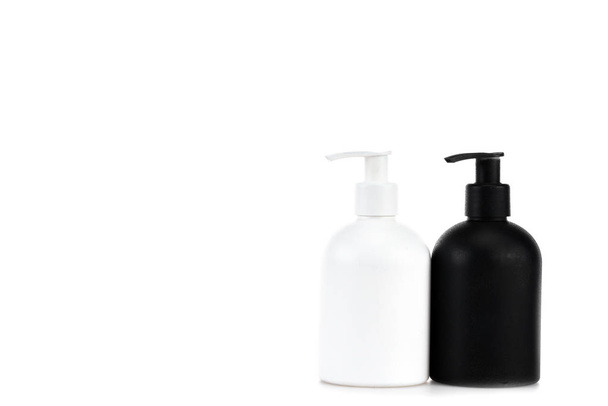 Black and white cosmetic spray bottles isolated on white - Photo, Image