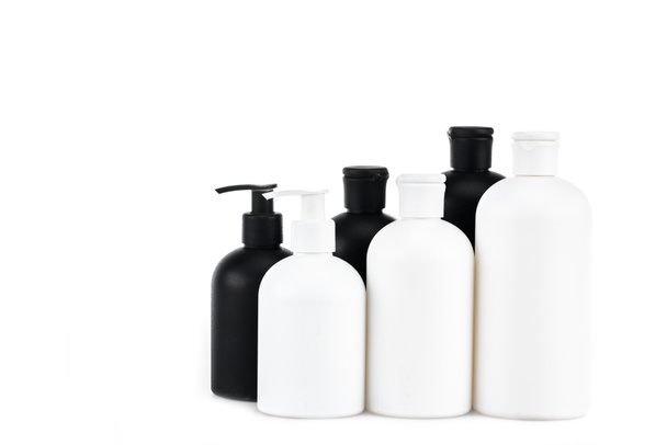 Black and white cosmetic bottles isolated on white - Foto, immagini