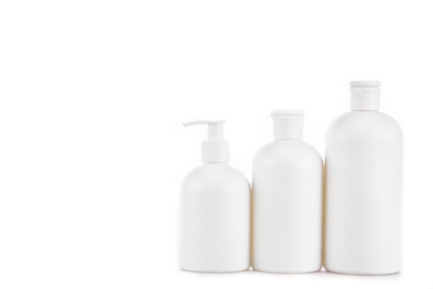 Three plastic white cosmetic bottles isolated on white - Фото, зображення