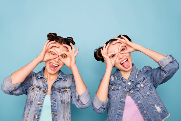 Portrait of cute charming positive hipsters fooling isolated spending weekends holidays free time making spectacles with hands feeling happiness wearing denim clothes on pastel background  - Fotó, kép