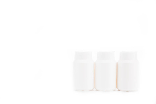 White cosmetic containers with caps isolated on white - Foto, Imagem