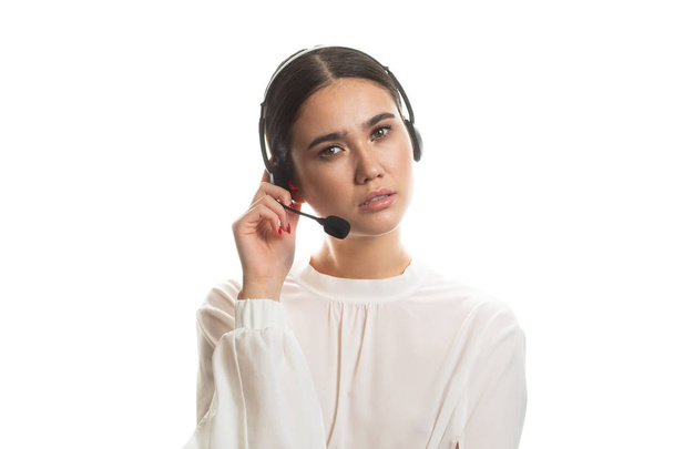 Beautiful consultant of call center in headphones on white background - Zdjęcie, obraz