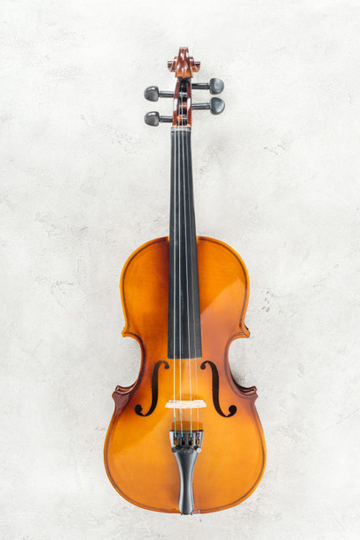 top view of classical cello on grey textured background  - Photo, Image